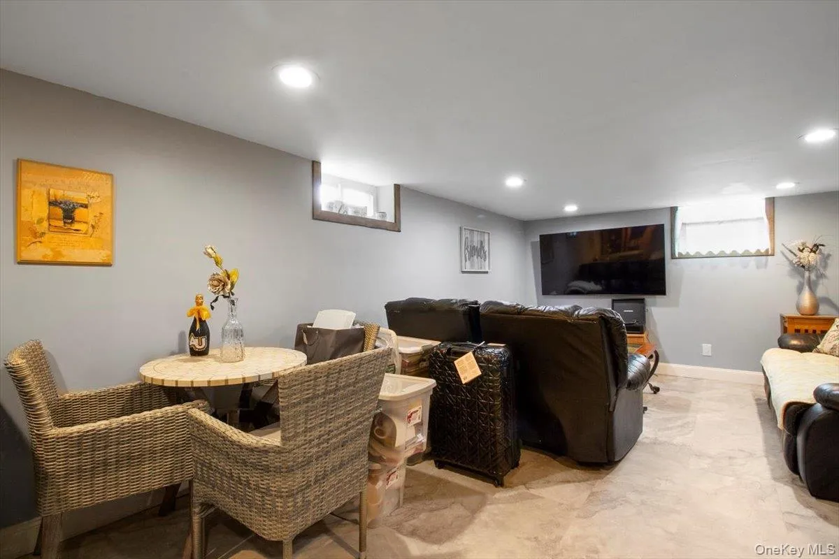 Living area with recessed lighting and baseboards Living area with recessed lighting and baseboards