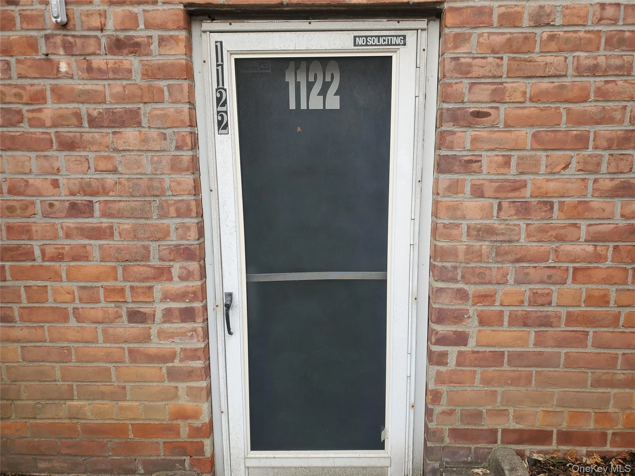 Entrance to property with brick siding Entrance to property with brick siding