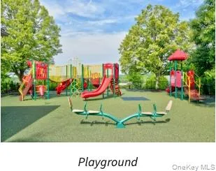 Community jungle gym featuring a lawn Community jungle gym featuring a lawn