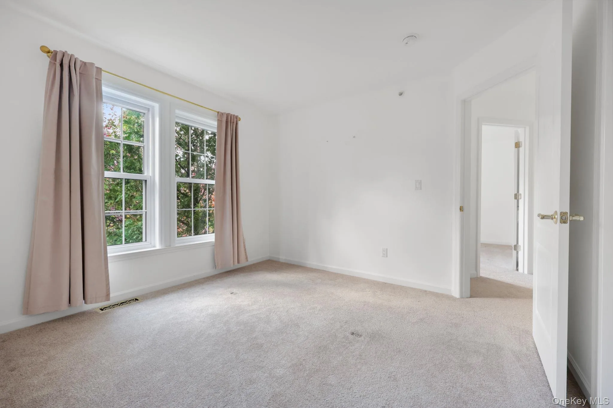Unfurnished room with carpet flooring Unfurnished room with carpet flooring