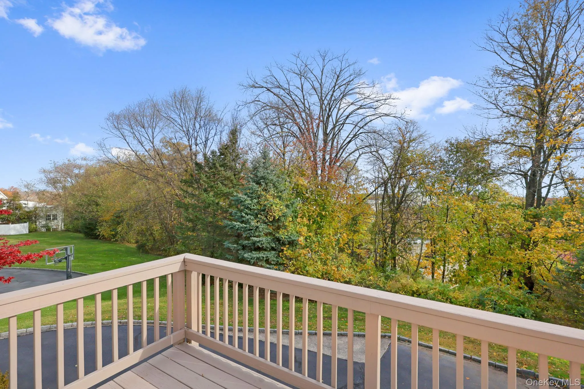 Deck featuring a lawn Deck featuring a lawn