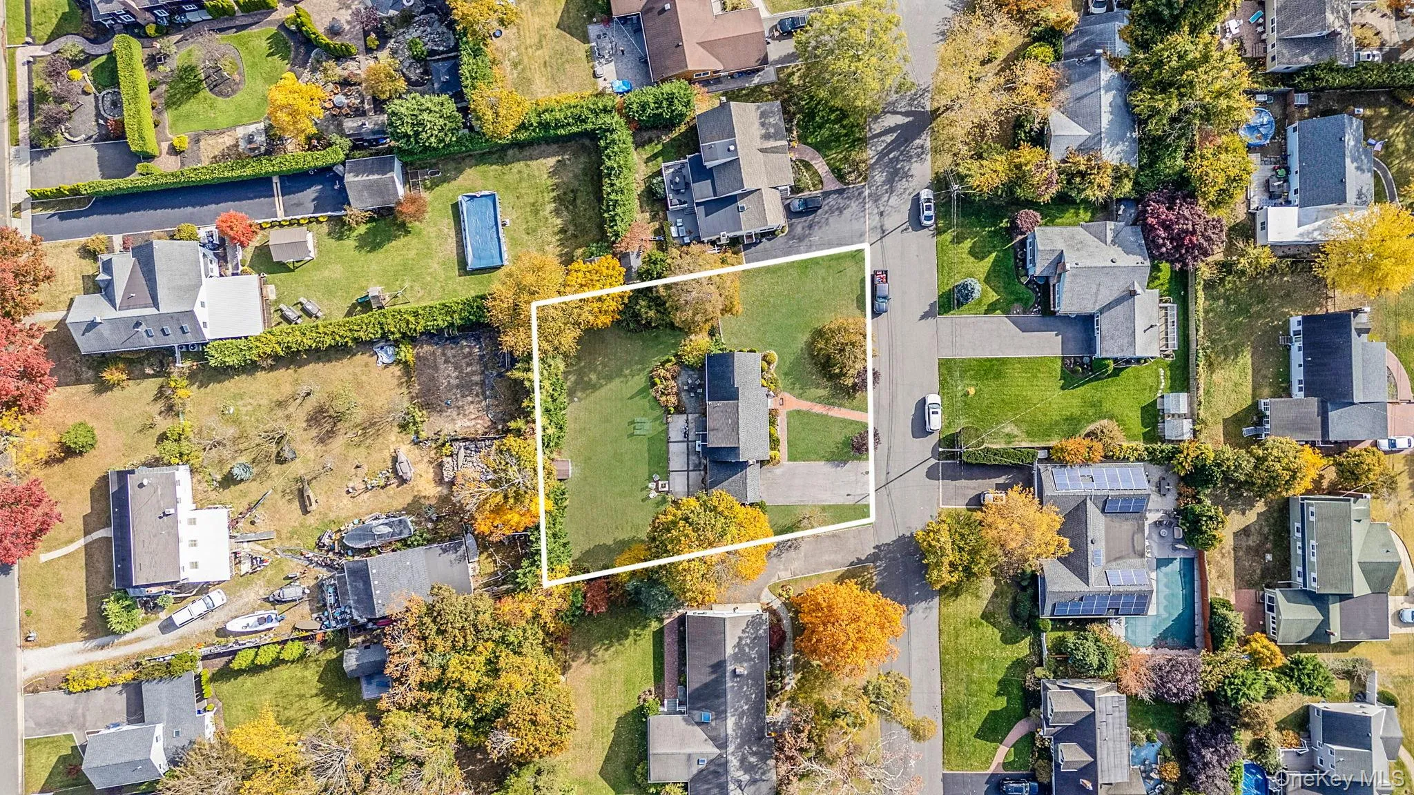 Aerial view of residential area with property parcel outlined Aerial view of residential area with property parcel outlined