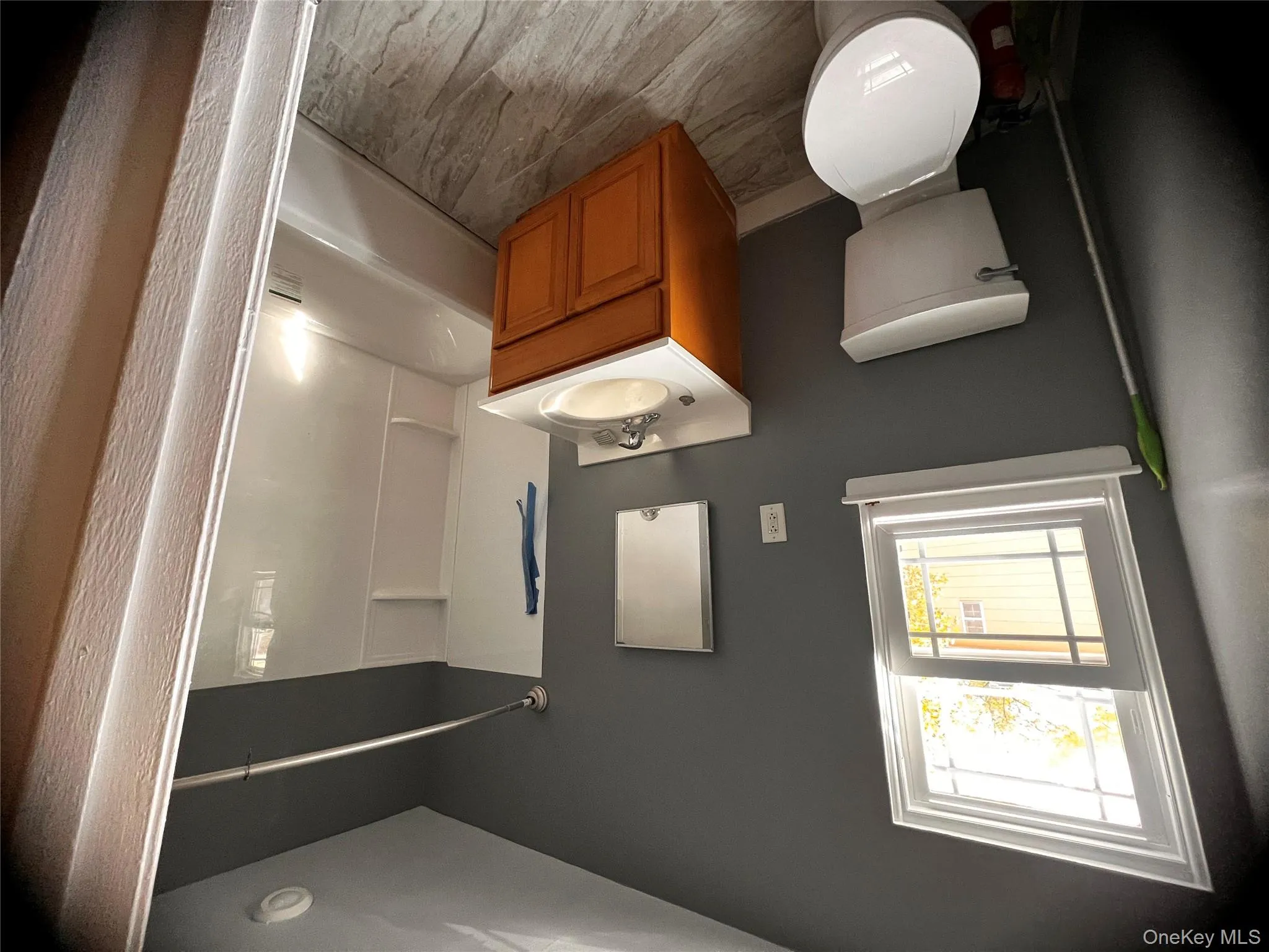 Bathroom featuring vanity and bathtub / shower combination Bathroom featuring vanity and bathtub / shower combination