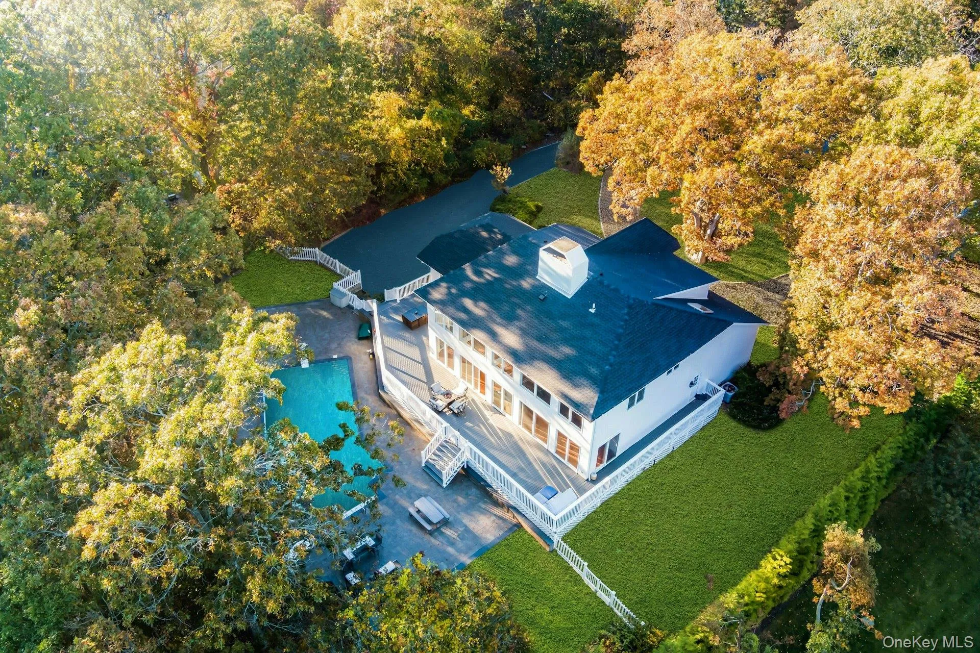 View from above of property featuring a heavily wooded area View from above of property featuring a heavily wooded area