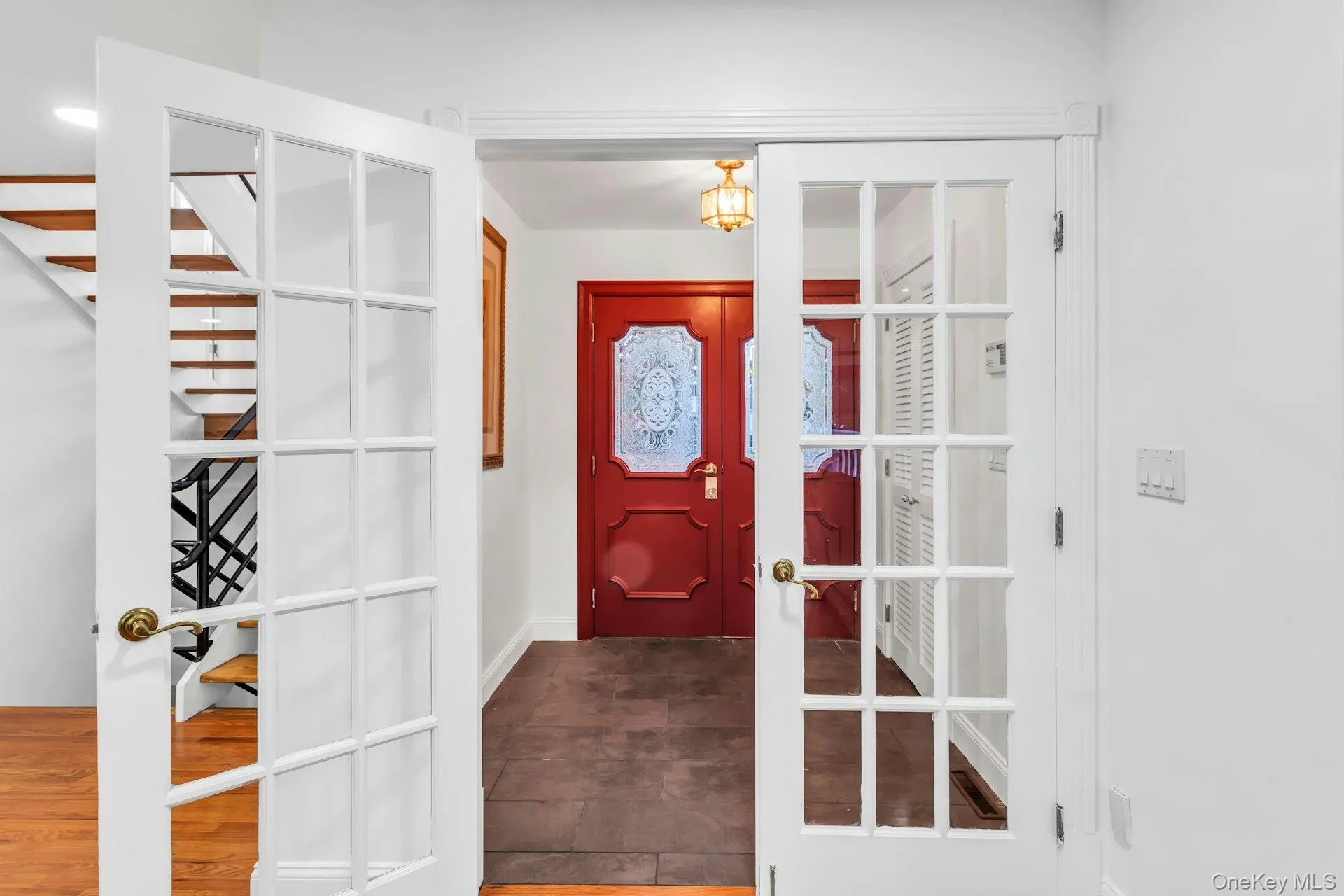 Entrance foyer featuring french doors and baseboards Entrance foyer featuring french doors and baseboards