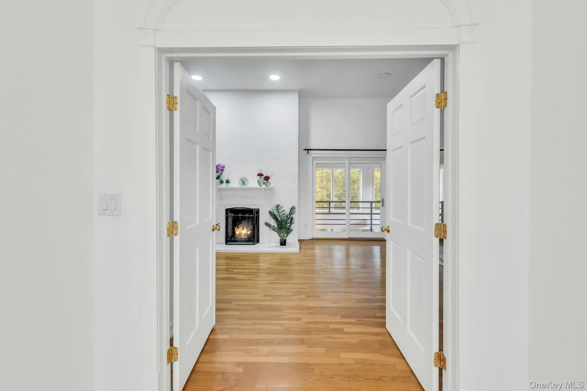 Corridor featuring light wood-style floors and recessed lighting Corridor featuring light wood-style floors and recessed lighting