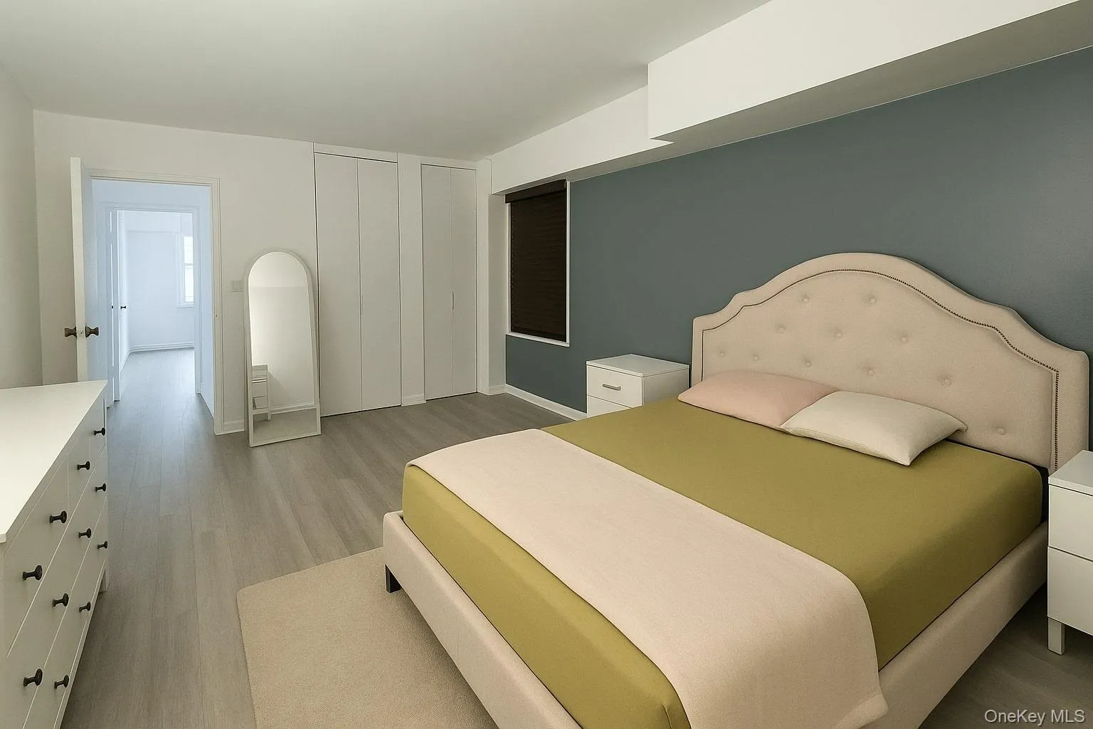 Bedroom with light wood-style flooring and a closet Bedroom with light wood-style flooring and a closet