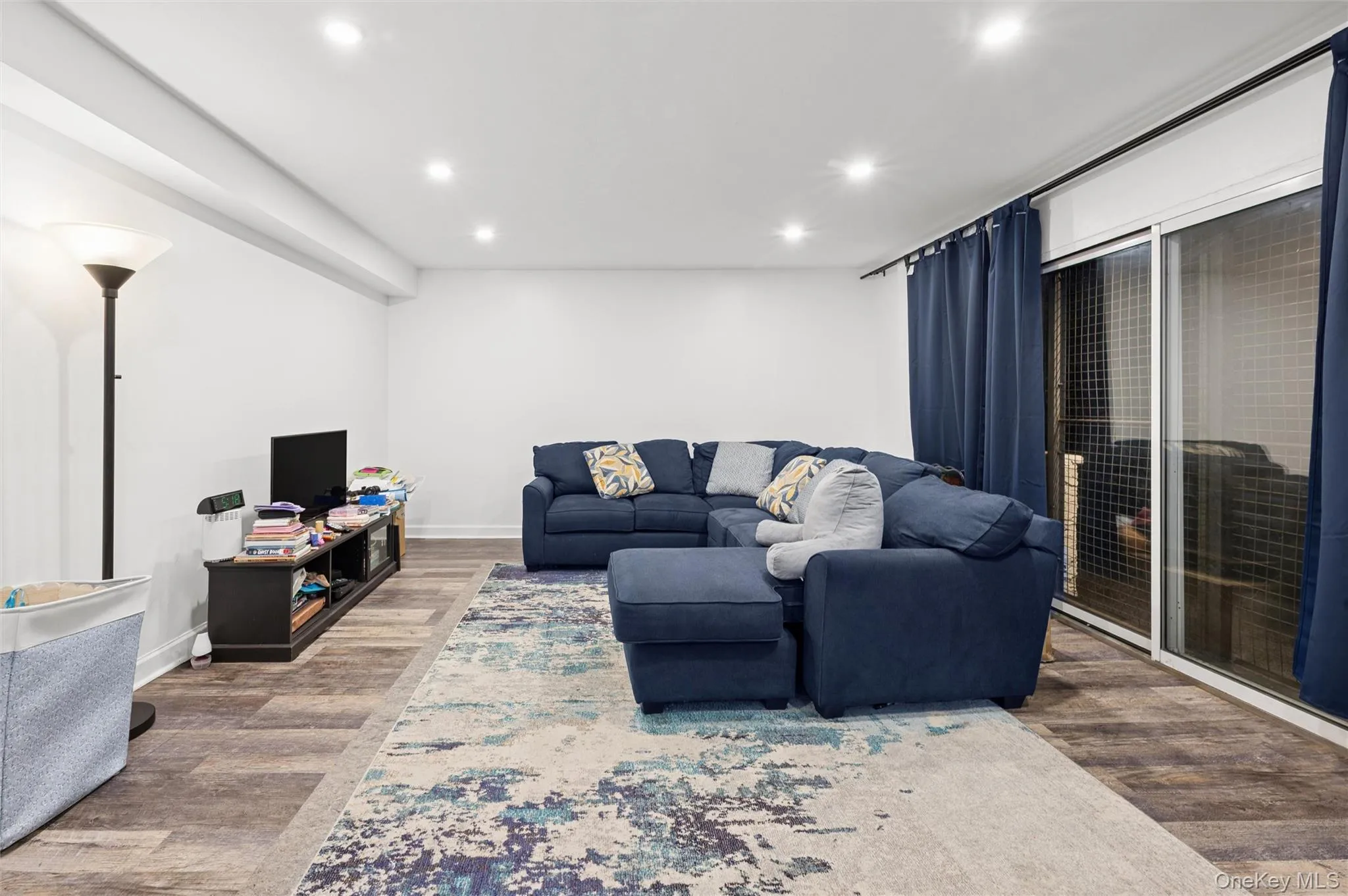 Living area featuring recessed lighting and wood finished floors Living area featuring recessed lighting and wood finished floors