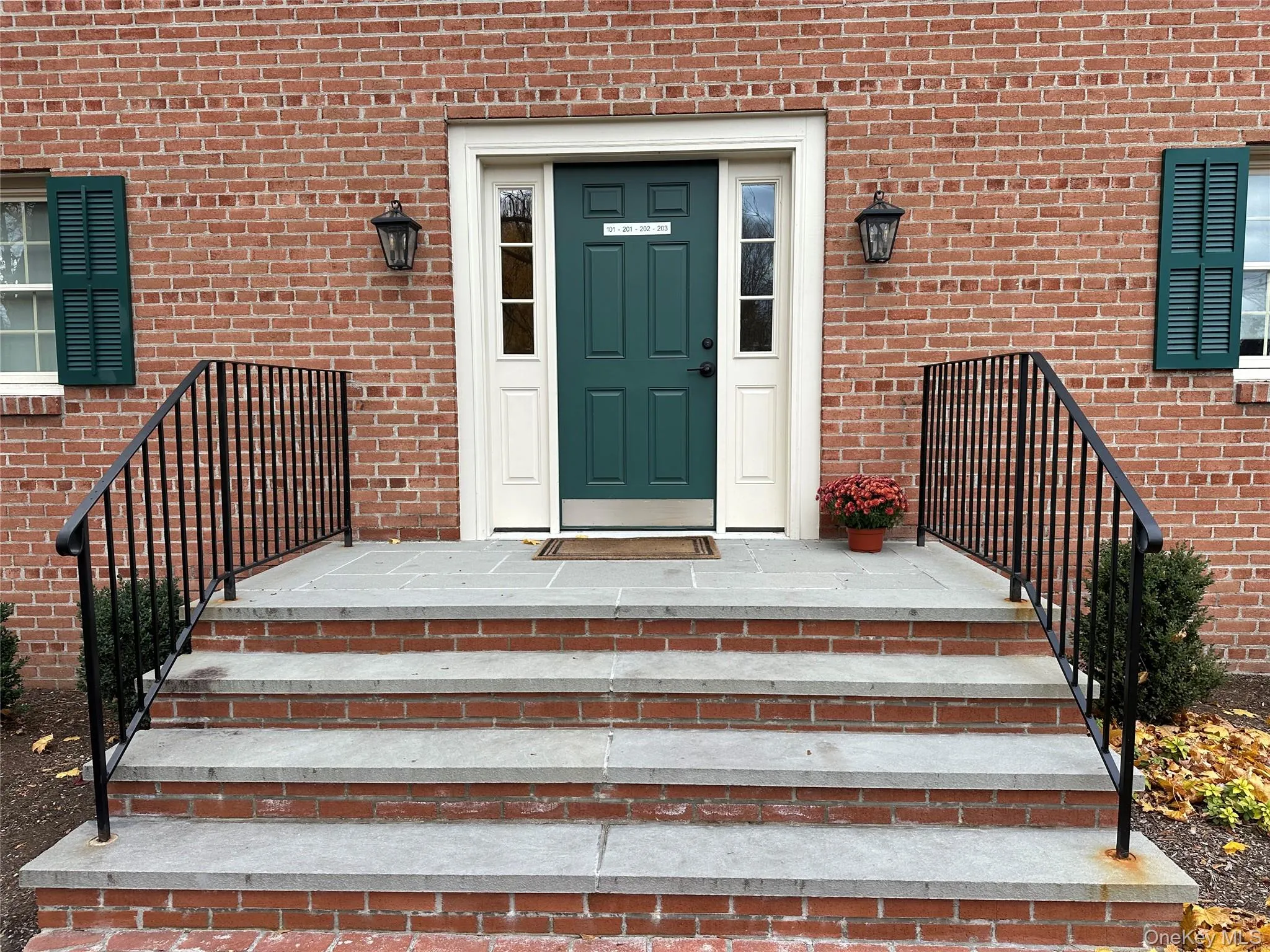 Entrance to property featuring brick siding Entrance to property featuring brick siding