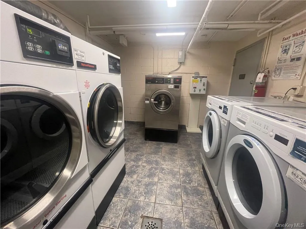 Shared laundry with independent washer and dryer and electric panel Shared laundry with independent washer and dryer and electric panel