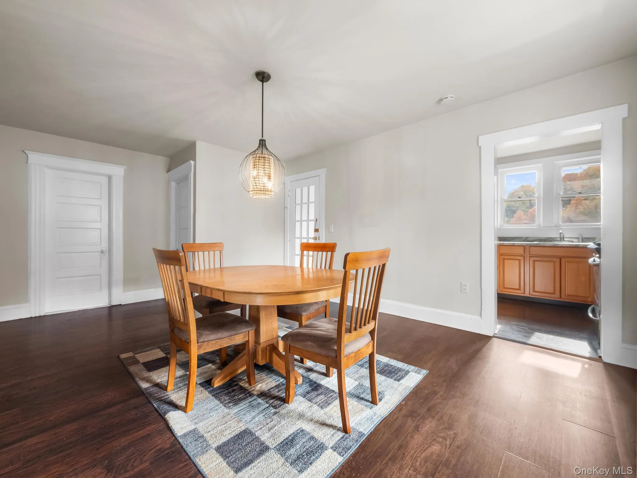Dining room featuring dark wood-type flooring Dining room featuring dark wood-type flooring