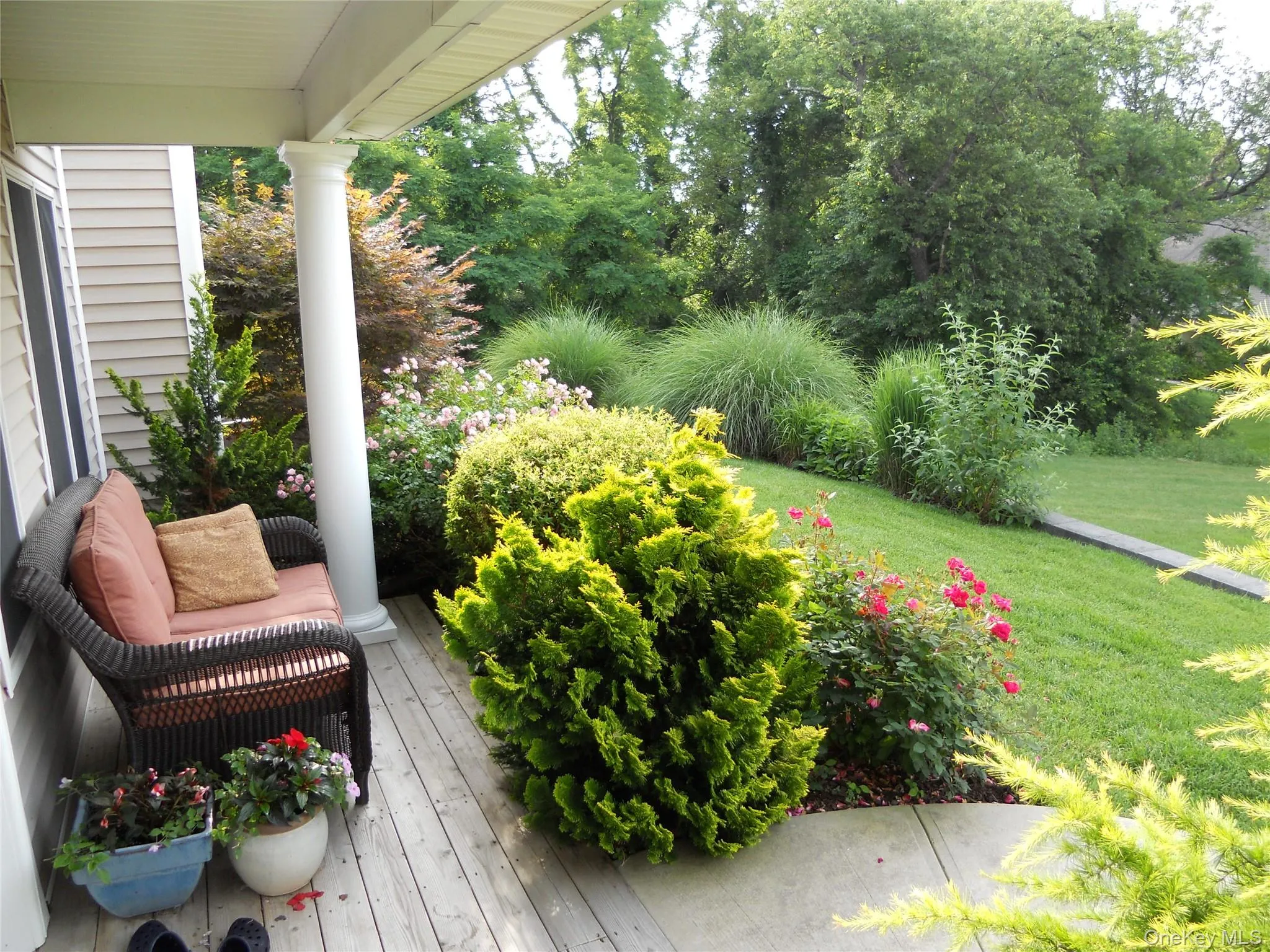 Wooden deck featuring a yard Wooden deck featuring a yard