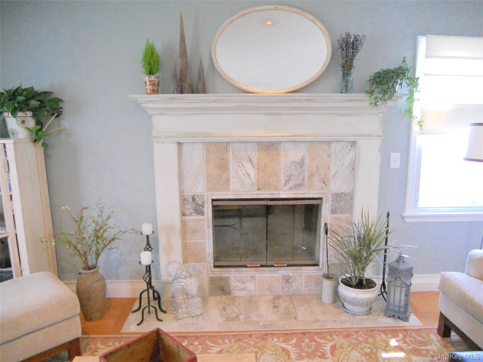 Detailed view of a tile fireplace and baseboards Detailed view of a tile fireplace and baseboards