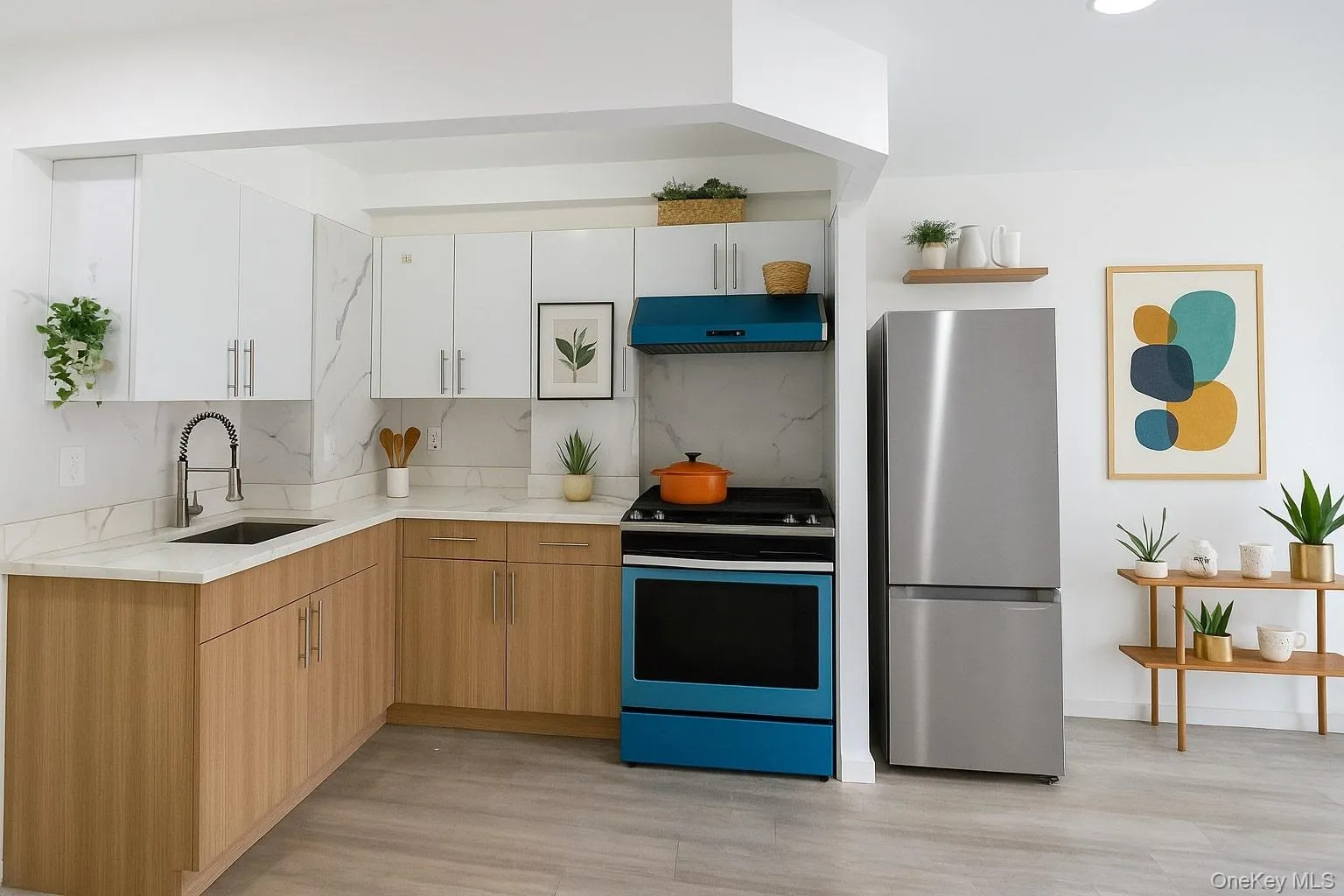 Virtually staged photo of kitchen featuring freestanding refrigerator, range with electric cooktop, white cabinets, under cabinet range hood, light stone countertops, and virtually staged modern decor Virtually staged photo of kitchen featuring freestanding refrigerator, range with electric cooktop, white cabinets, under cabinet range hood, light stone countertops, and virtually staged modern decor