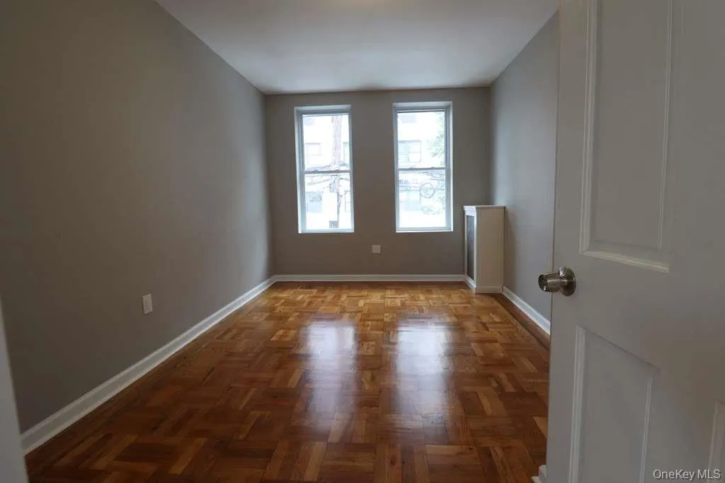 Empty room with baseboards Empty room with baseboards