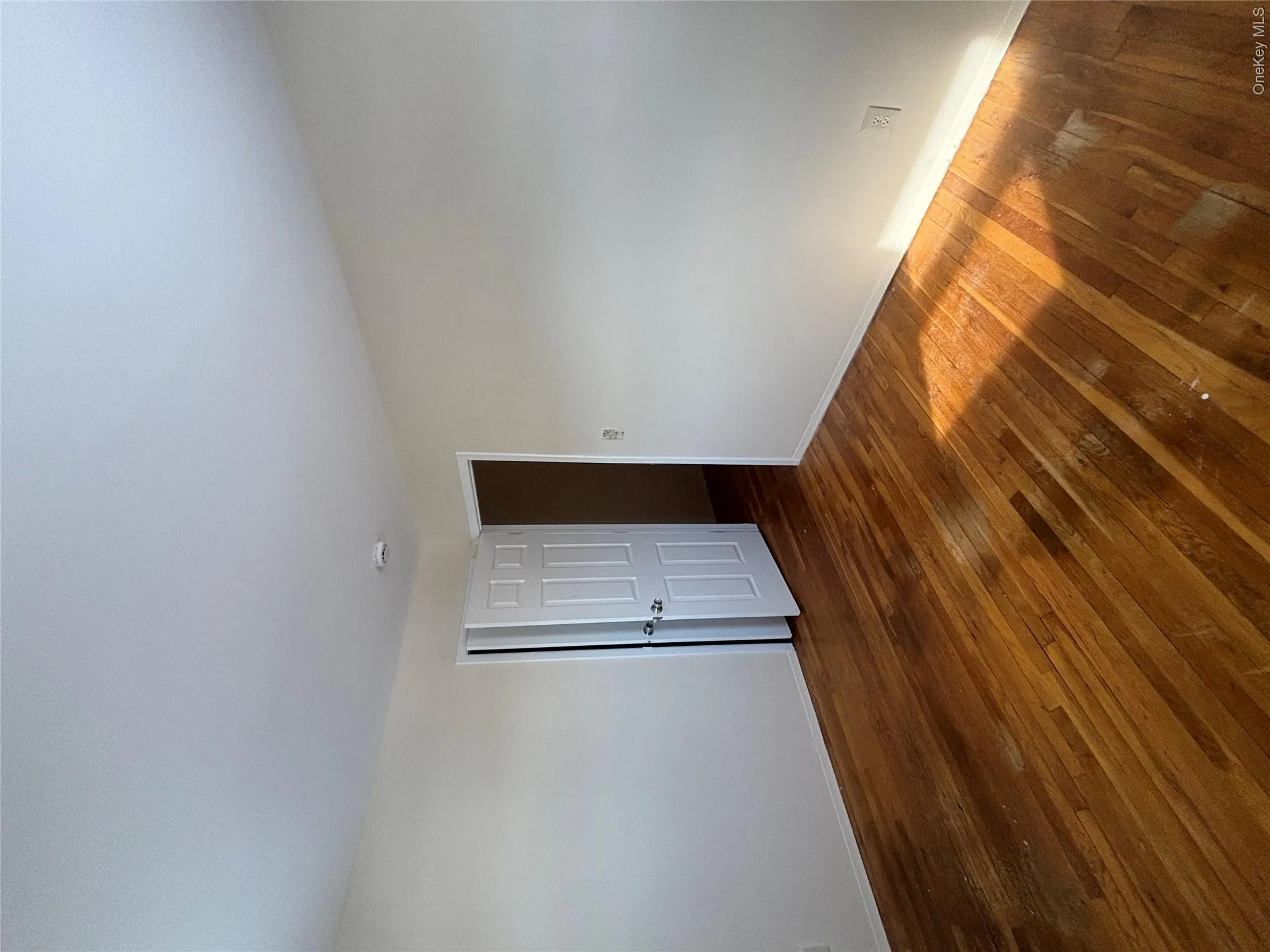 Spare room with dark wood-style flooring Spare room with dark wood-style flooring