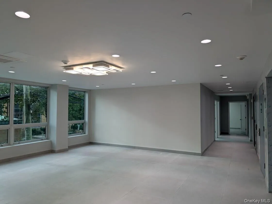 Common area with recessed lighting and hallway Common area with recessed lighting and hallway