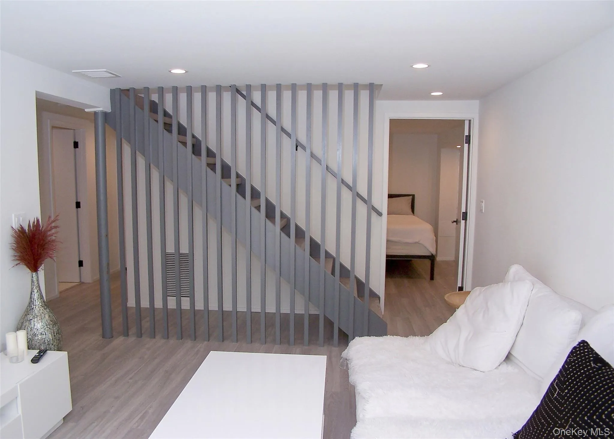Stairs featuring wood finished floors and recessed lighting Stairs featuring wood finished floors and recessed lighting