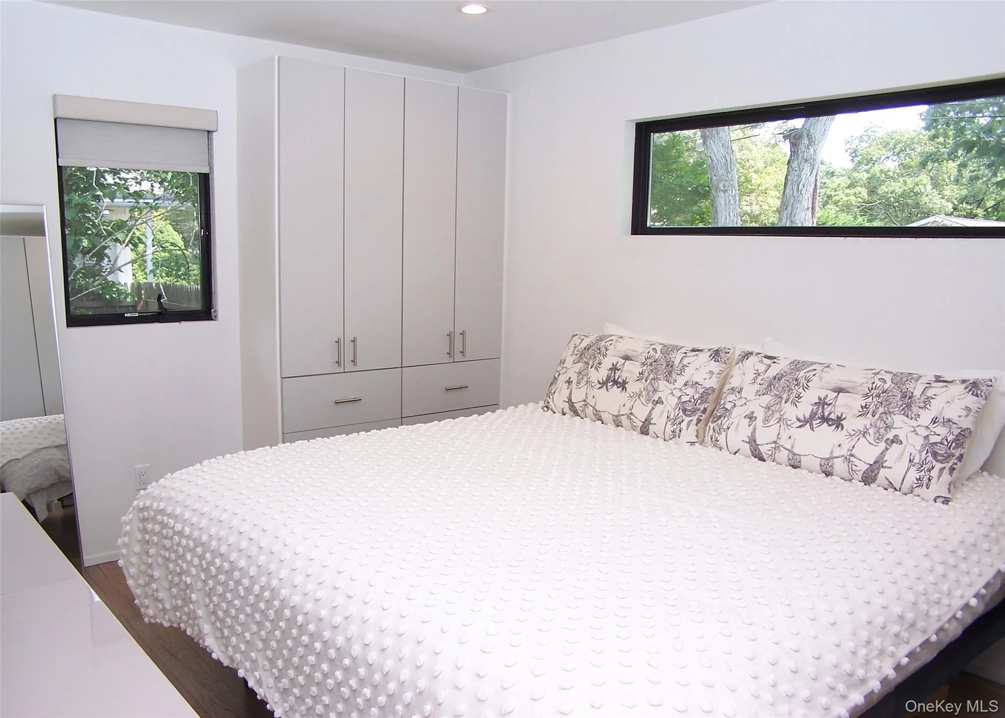 Bedroom featuring dark wood-style floors and recessed lighting Bedroom featuring dark wood-style floors and recessed lighting