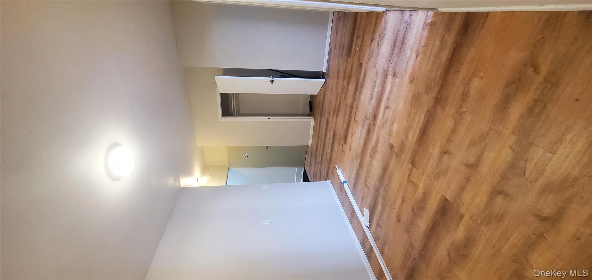 Unfurnished room with light wood-style flooring and baseboards Unfurnished room with light wood-style flooring and baseboards