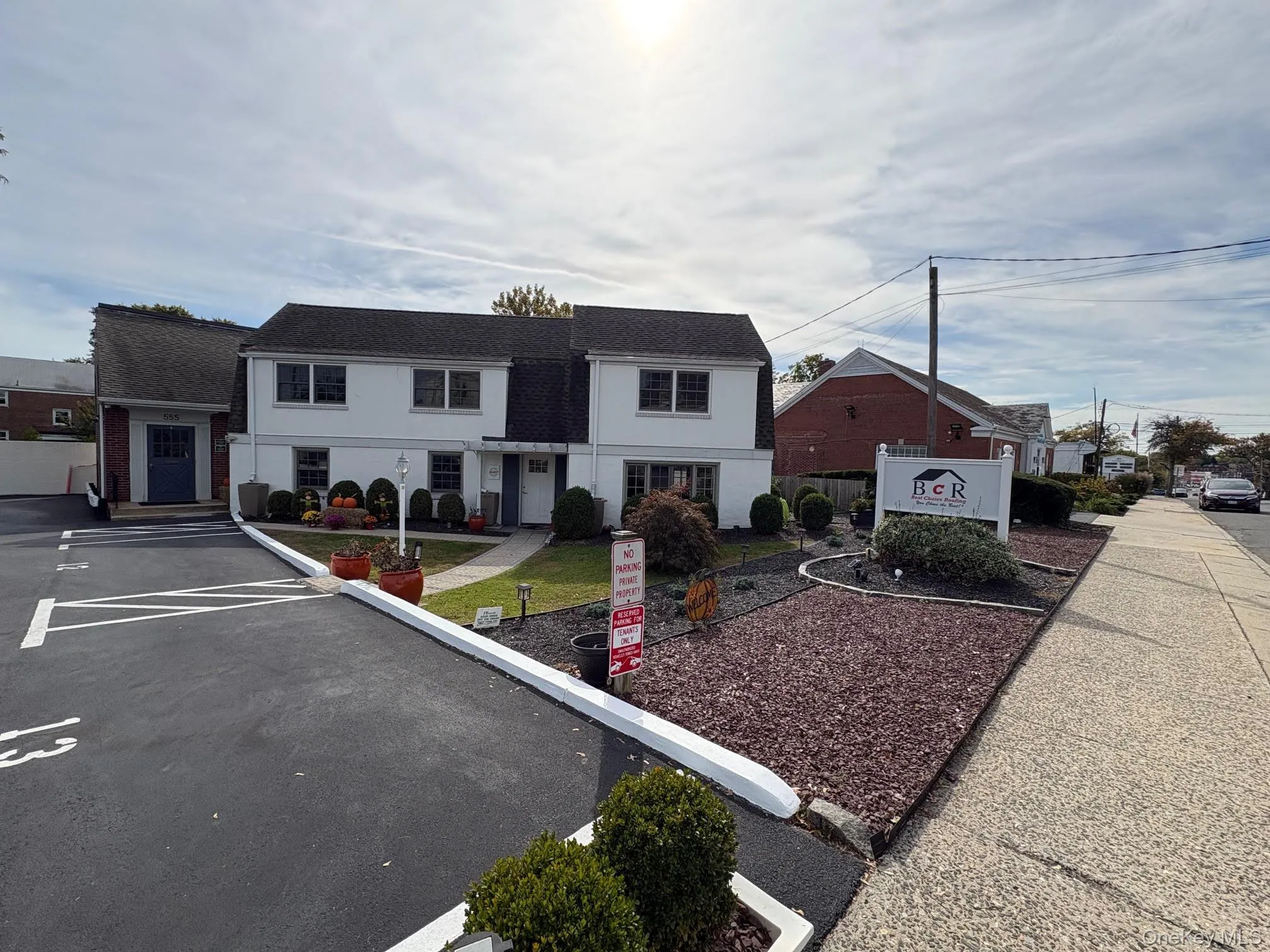 Traditional-style home with uncovered parking Traditional-style home with uncovered parking