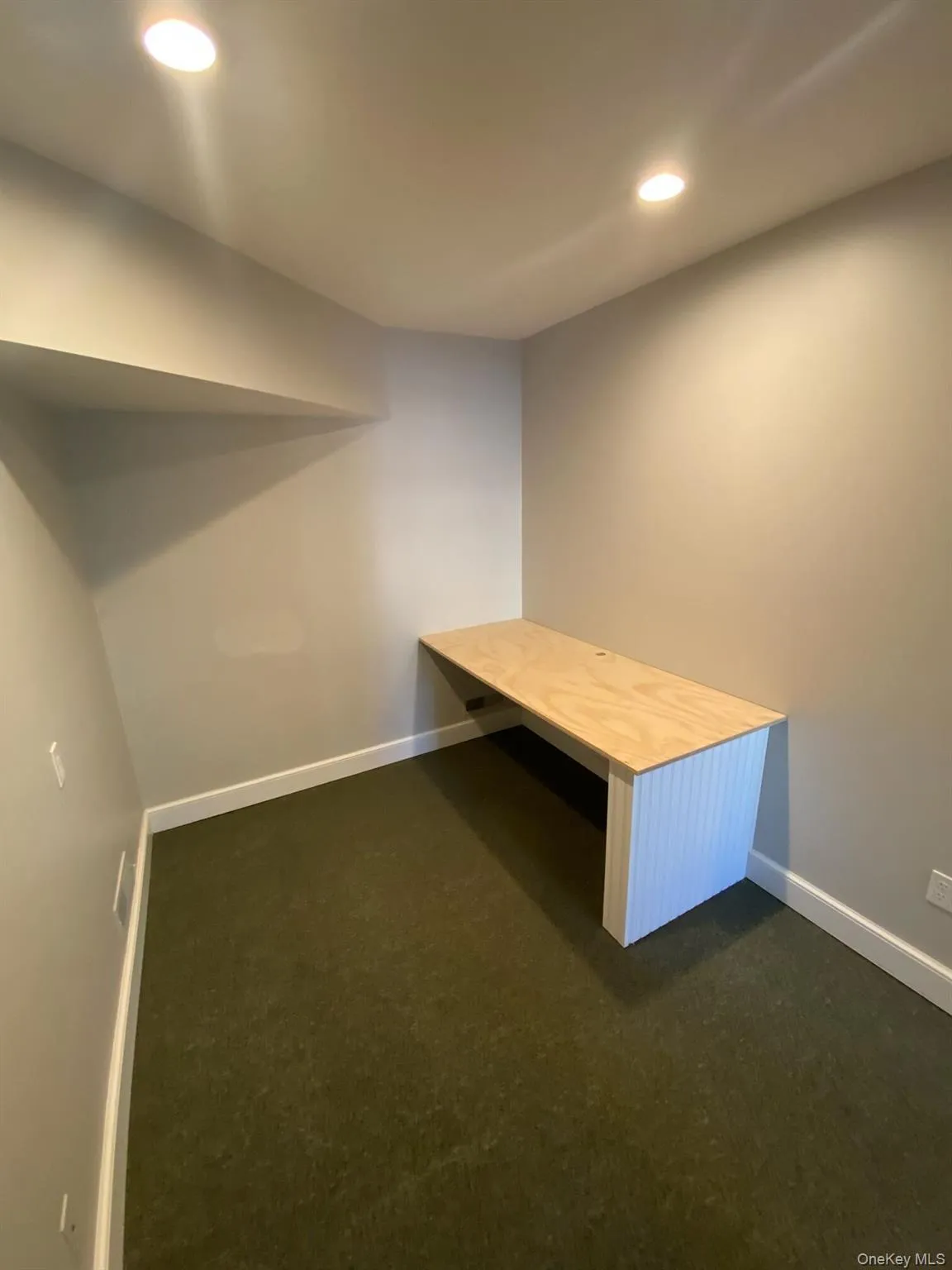 Unfurnished office with recessed lighting and dark carpet Unfurnished office with recessed lighting and dark carpet