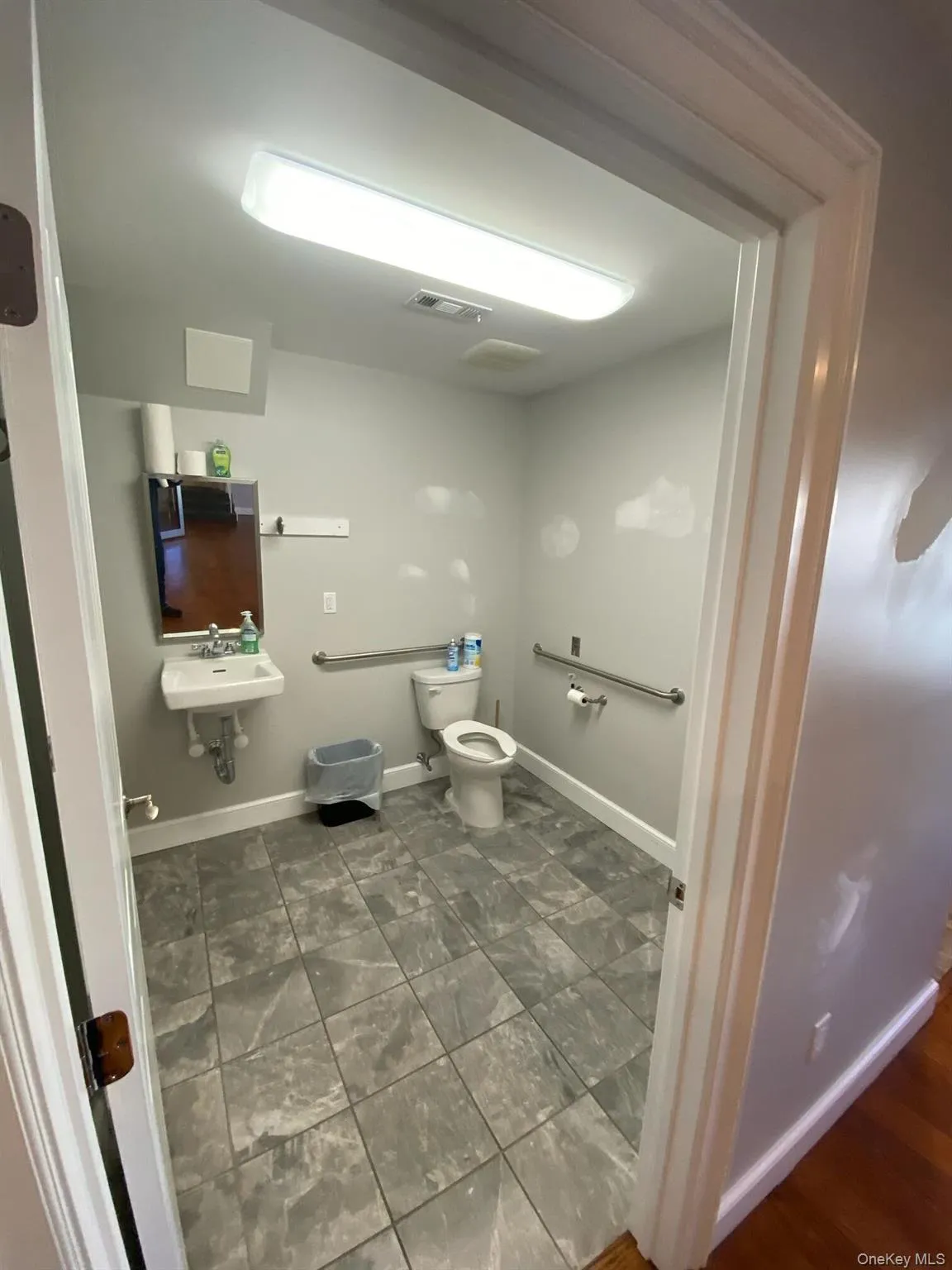 Bathroom with toilet and baseboards Bathroom with toilet and baseboards