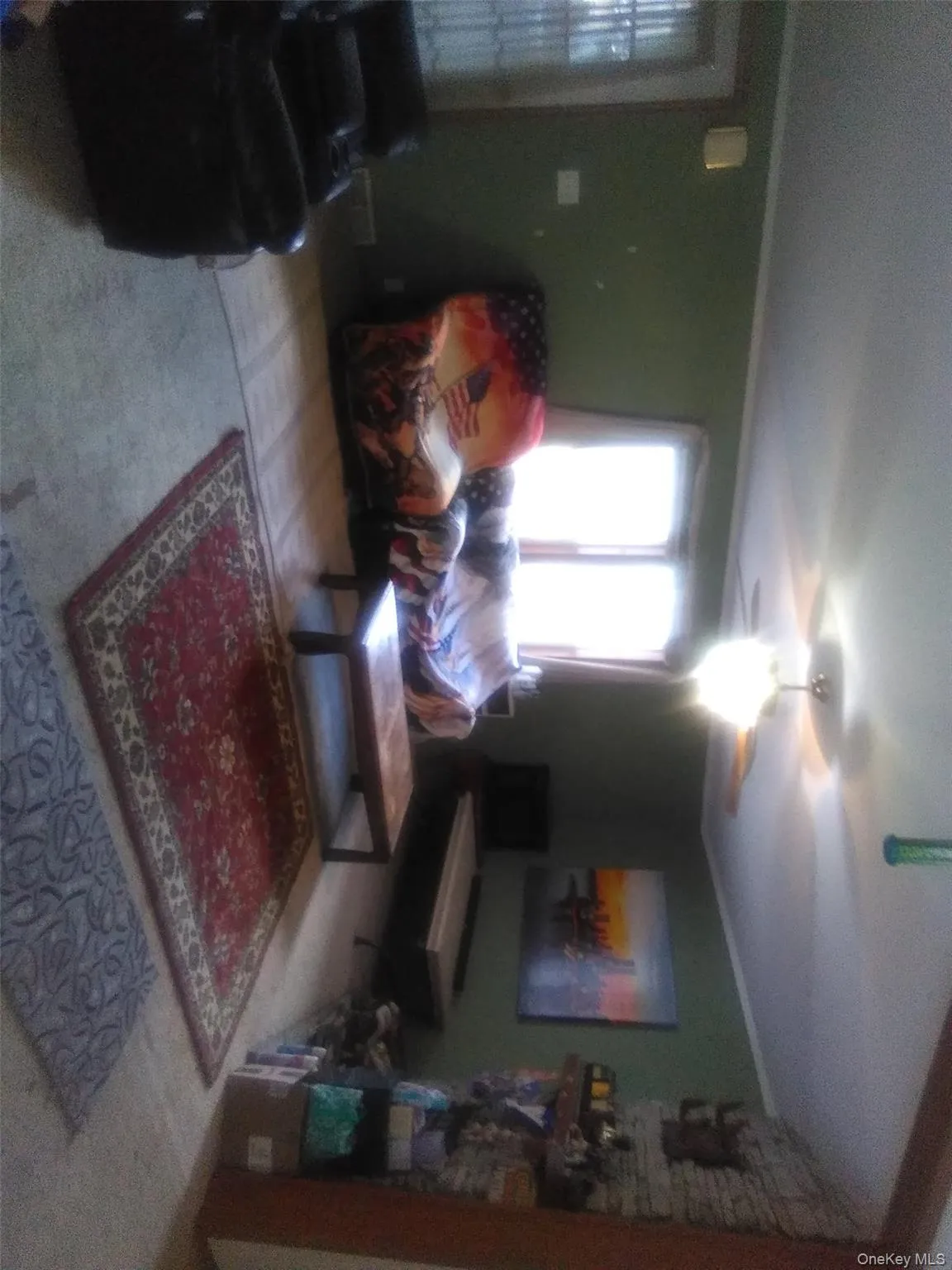 Living room with crown molding, carpet flooring, and a ceiling fan Living room with crown molding, carpet flooring, and a ceiling fan