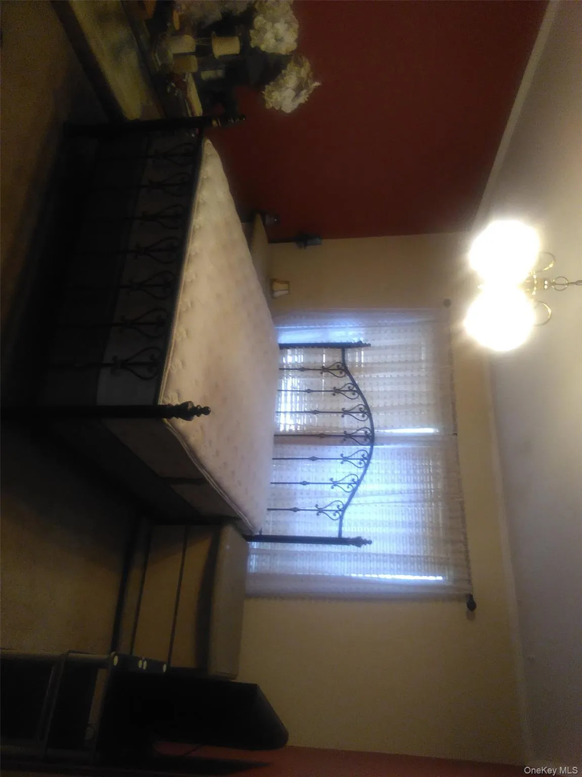 Bedroom with ornamental molding and a chandelier Bedroom with ornamental molding and a chandelier