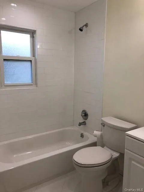Full bath featuring vanity and shower / washtub combination Full bath featuring vanity and shower / washtub combination