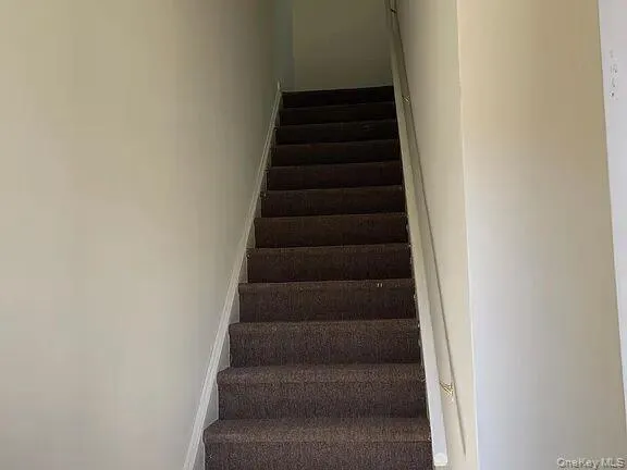 Stairs featuring baseboards Stairs featuring baseboards