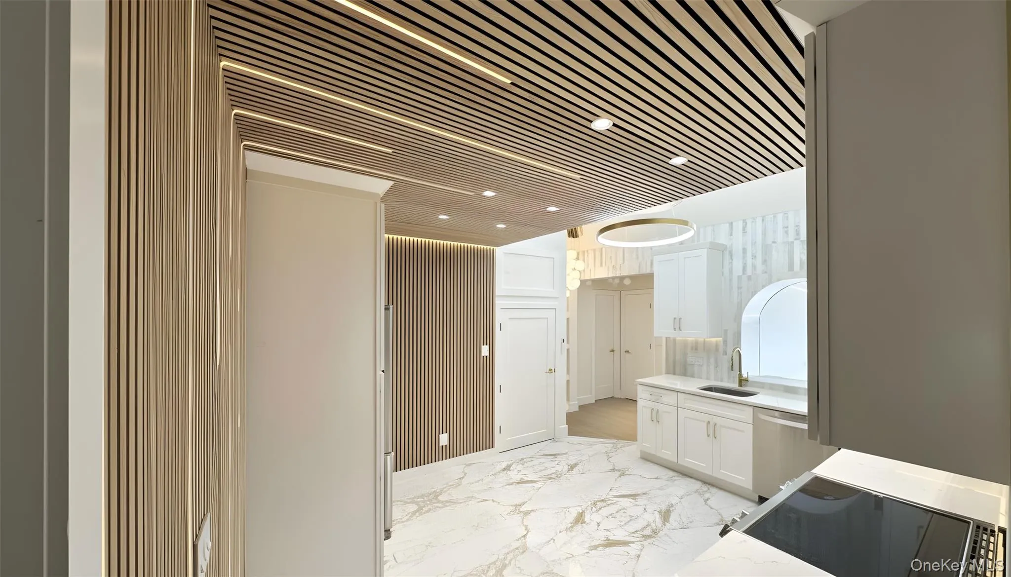 Bathroom with vanity and light marble finish floors Bathroom with vanity and light marble finish floors