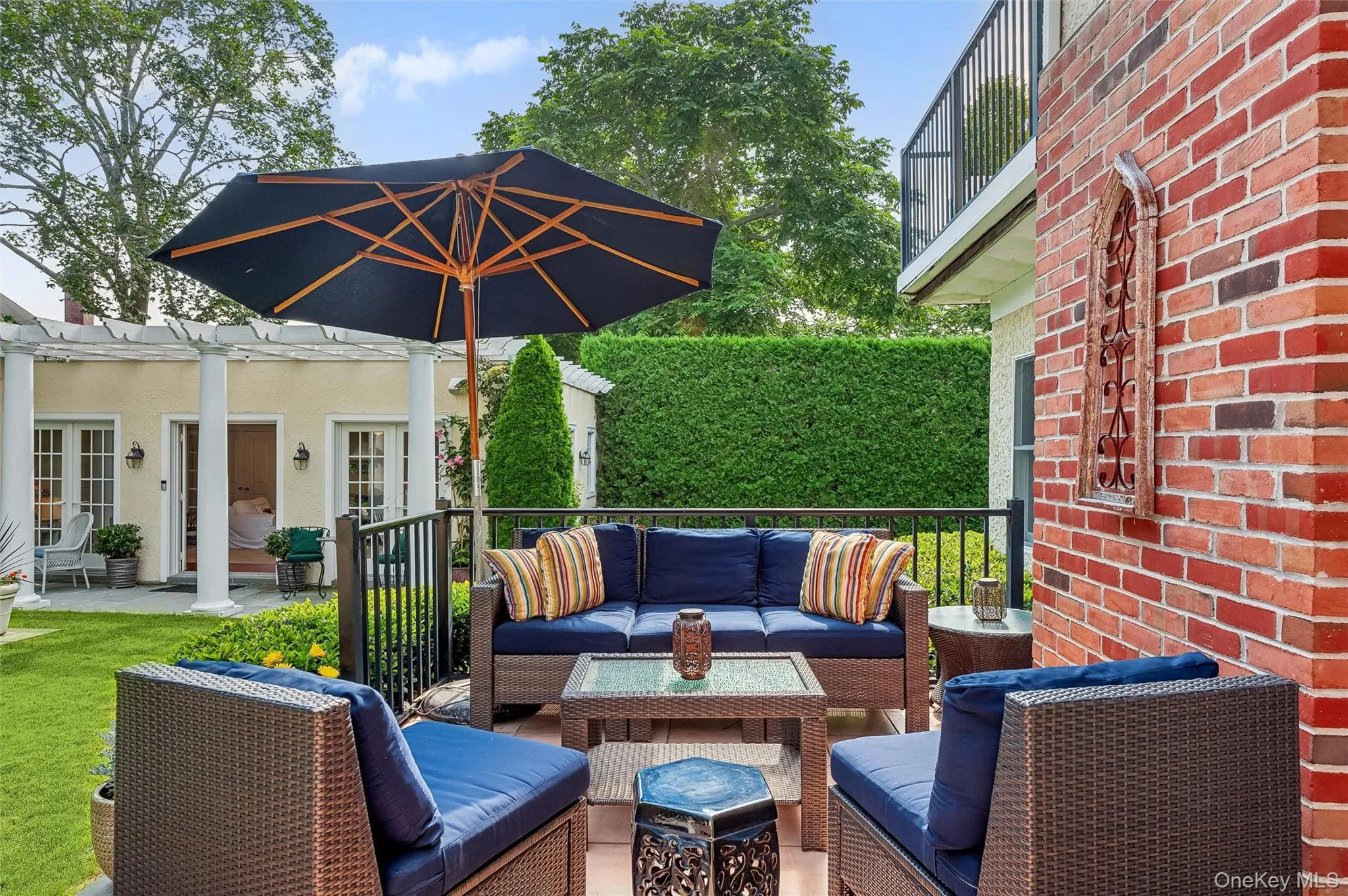 View of patio with an outdoor hangout area, french doors, and a wooden deck View of patio with an outdoor hangout area, french doors, and a wooden deck