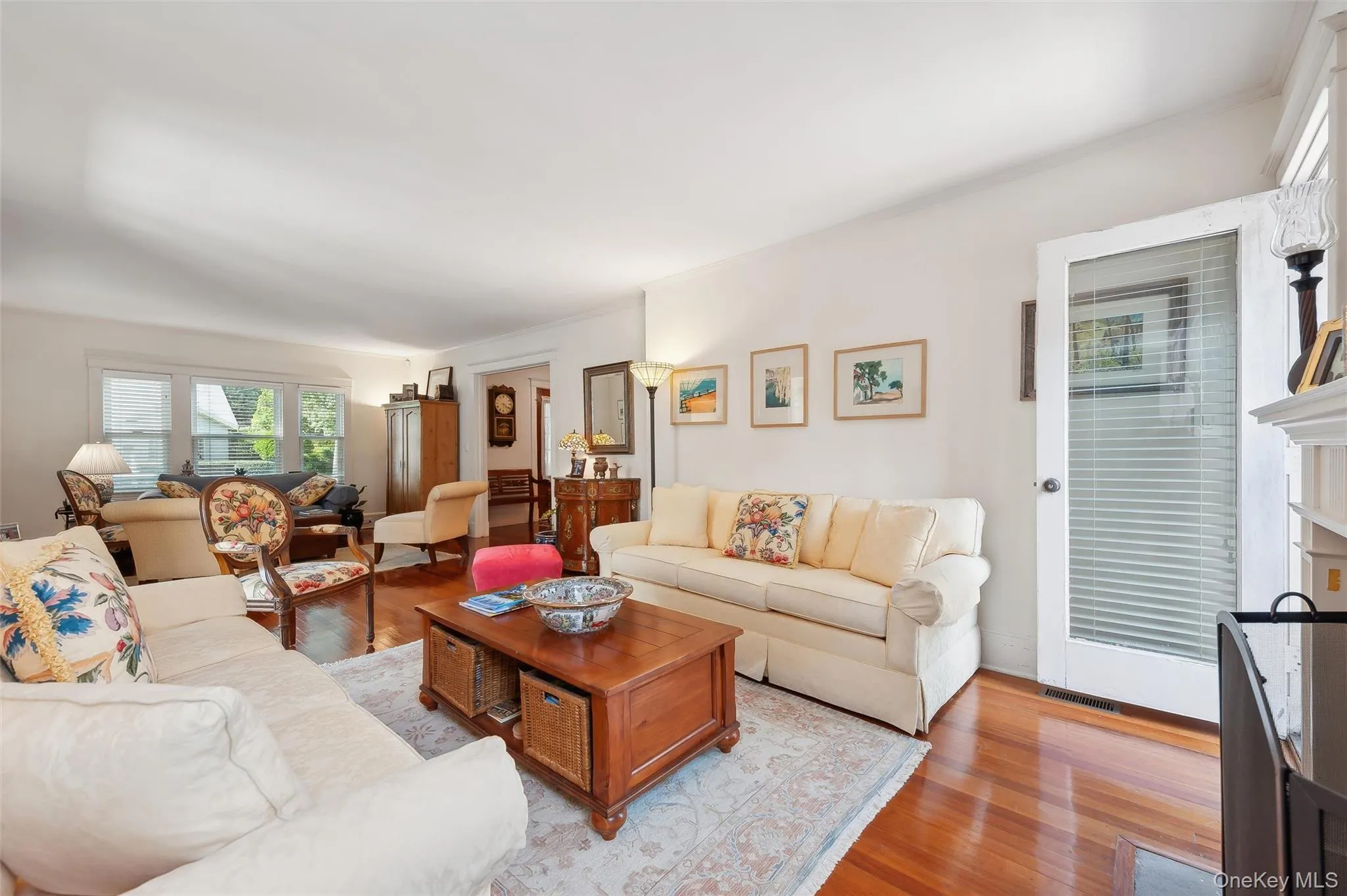 Living room with light wood-type flooring and a fireplace Living room with light wood-type flooring and a fireplace