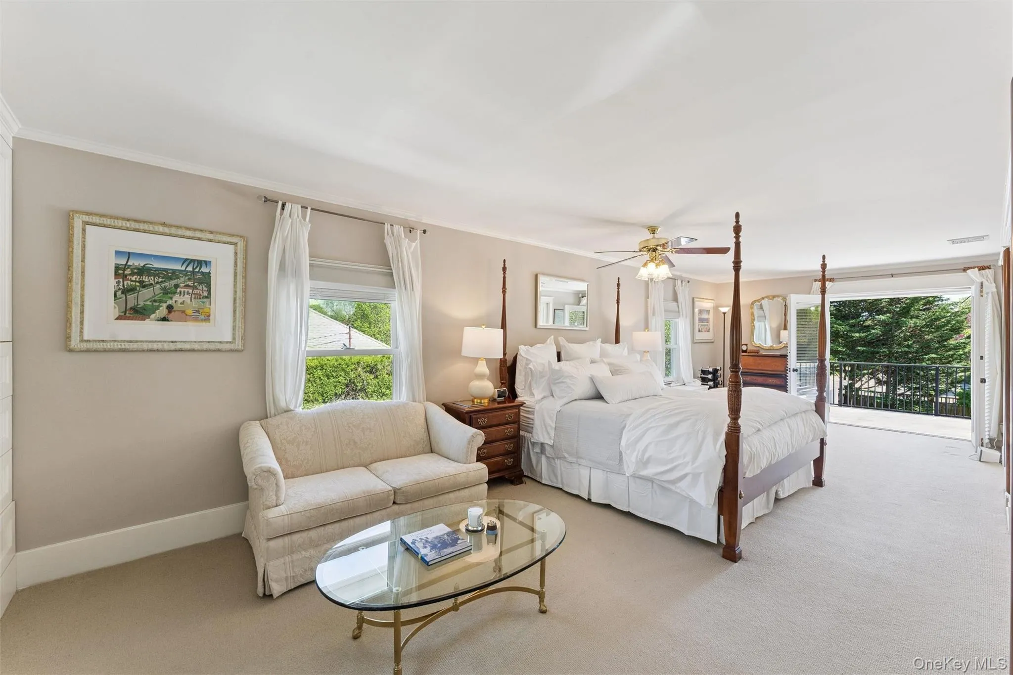 Carpeted bedroom with ornamental molding, a ceiling fan, and access to exterior Carpeted bedroom with ornamental molding, a ceiling fan, and access to exterior