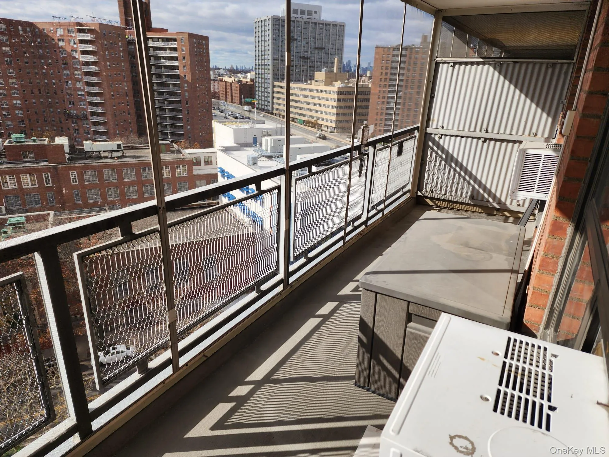 Balcony with a view of city and a sunroom Balcony with a view of city and a sunroom