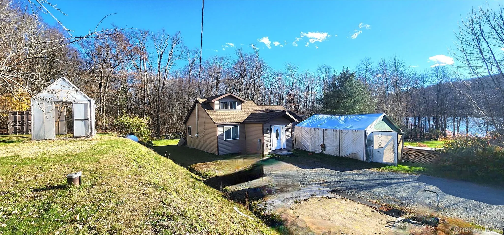 View of home's exterior featuring a shed and a lawn View of home's exterior featuring a shed and a lawn