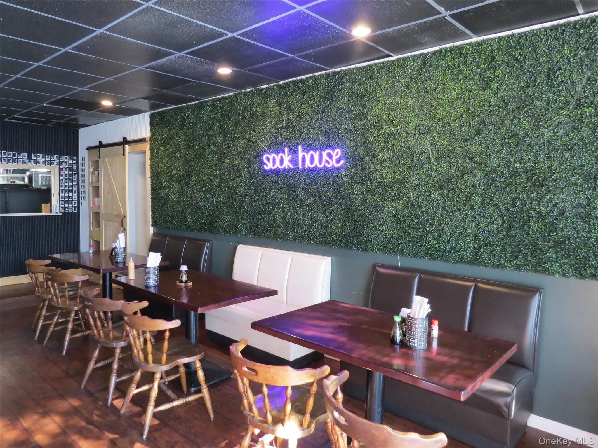 Dining area with dark wood finished floors Dining area with dark wood finished floors