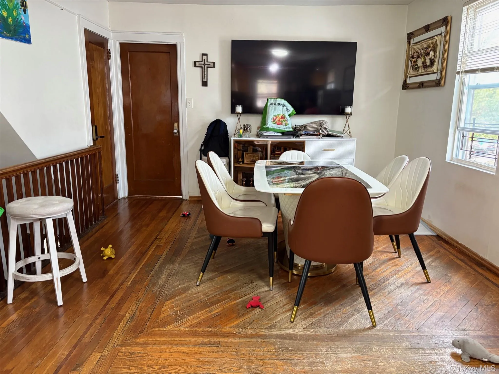 Dining room with wood-type flooring Dining room with wood-type flooring