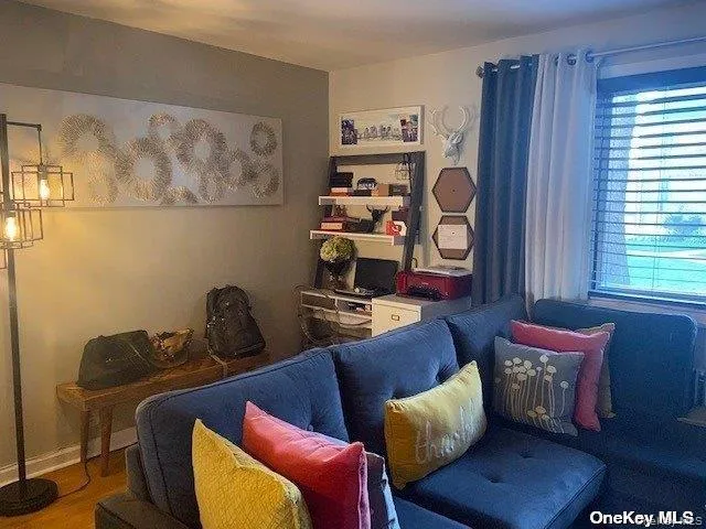 Living area featuring wood finished floors Living area featuring wood finished floors