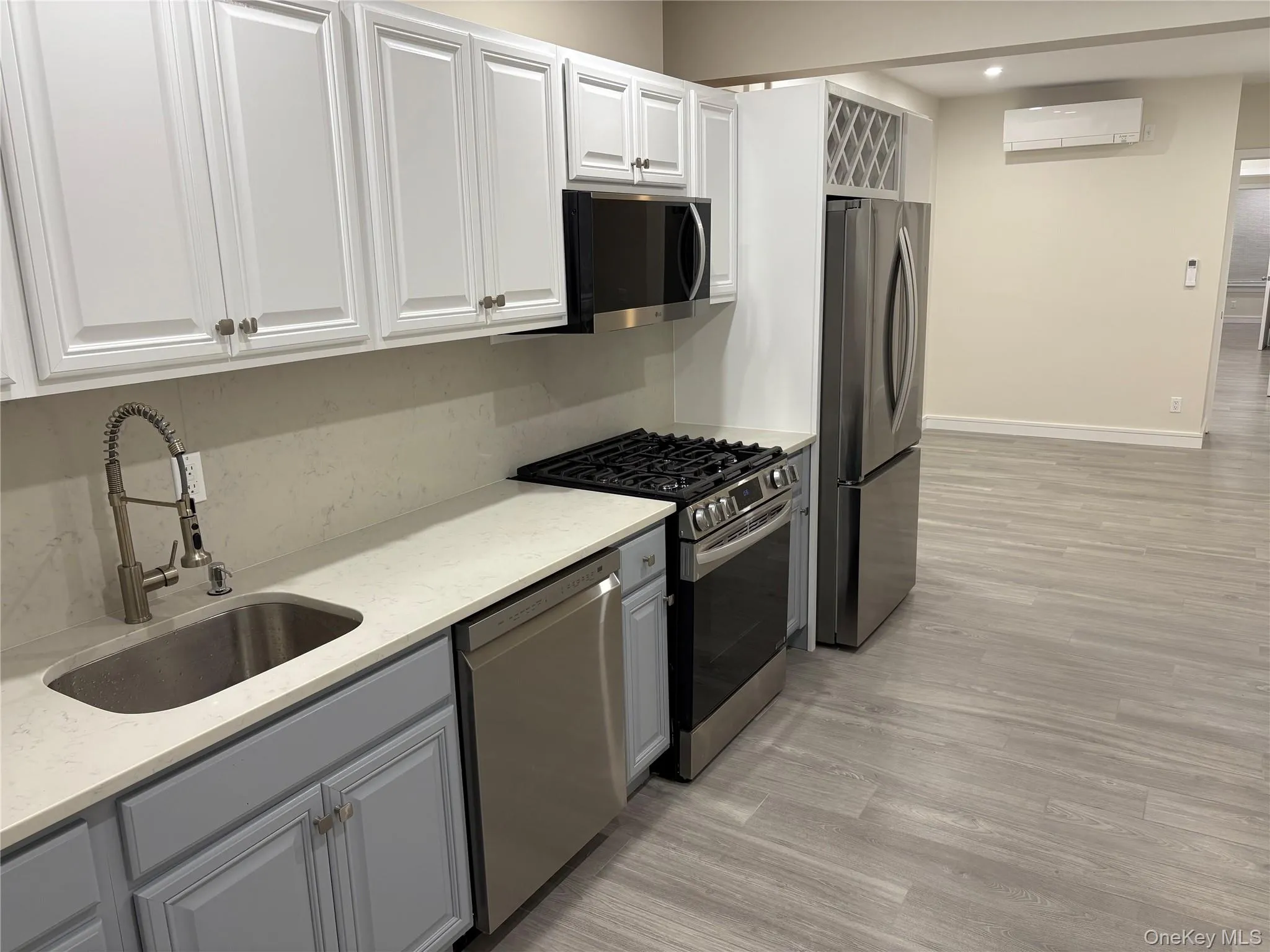 Kitchen stainless steel appliances, light stone countertops Kitchen stainless steel appliances, light stone countertops