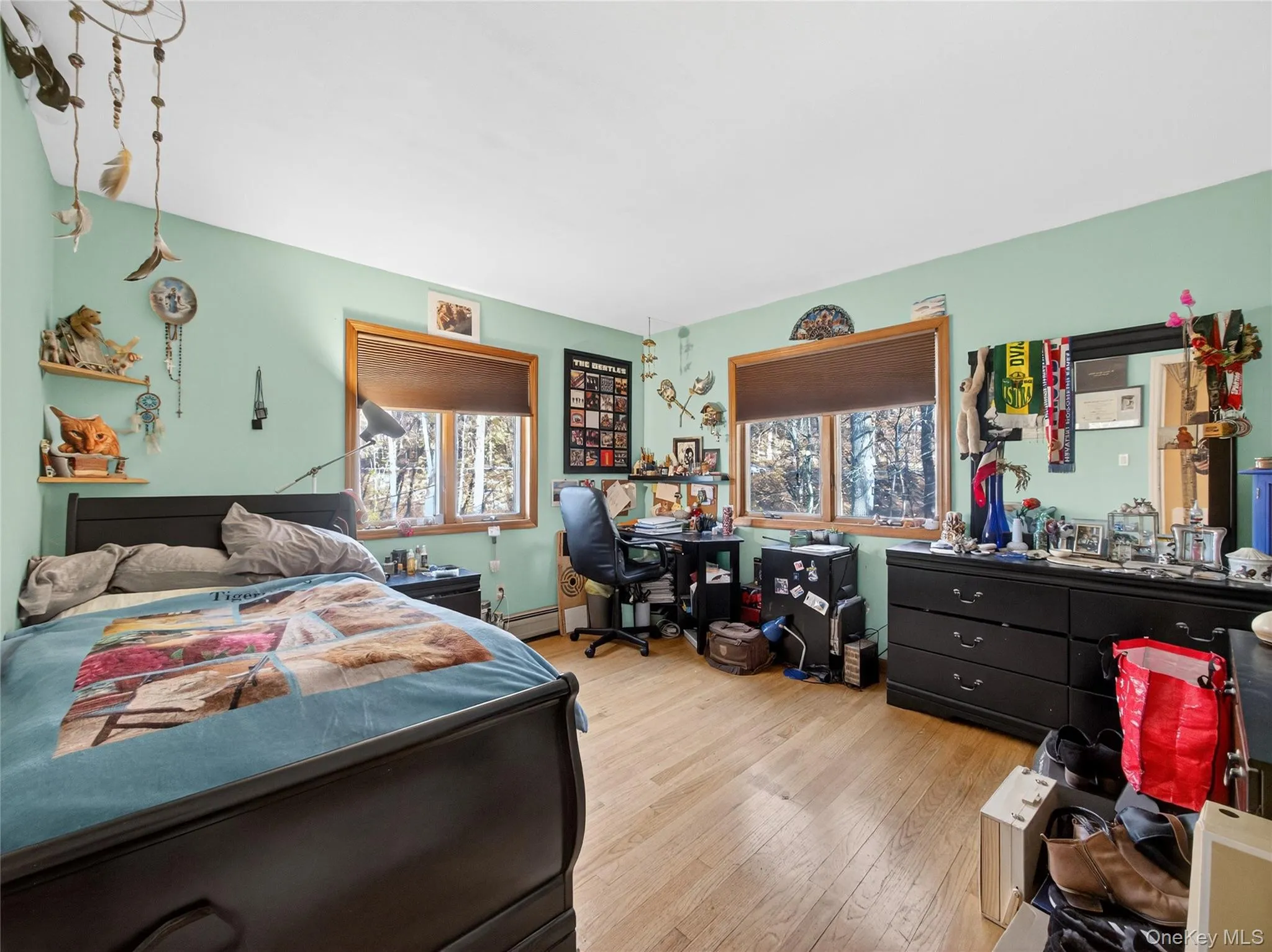 Bedroom with wood finished floors and a desk Bedroom with wood finished floors and a desk