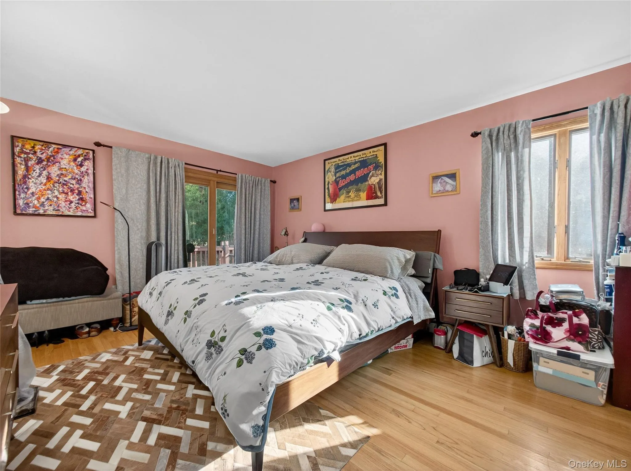 Bedroom featuring light wood-style floors and access to outside Bedroom featuring light wood-style floors and access to outside