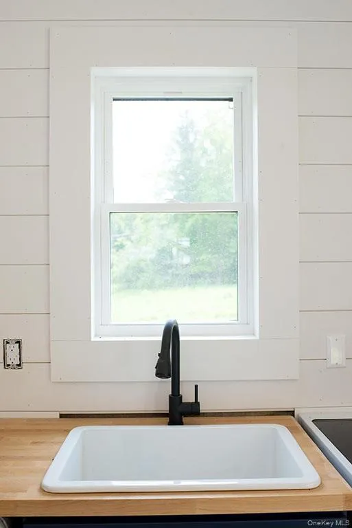 Kitchen view of wooden counters and a sink Kitchen view of wooden counters and a sink
