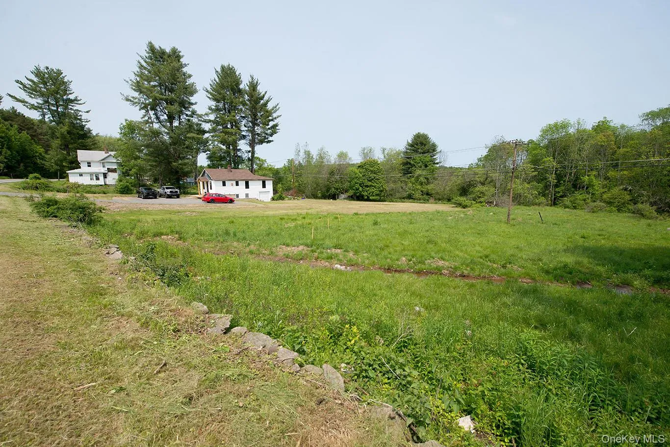 View of yard featuring a rural view and view of wooded area View of yard featuring a rural view and view of wooded area
