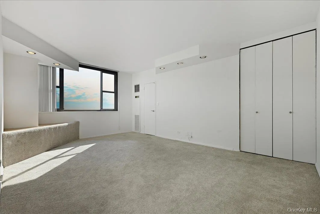 Unfurnished bedroom featuring recessed lighting and carpet Unfurnished bedroom featuring recessed lighting and carpet