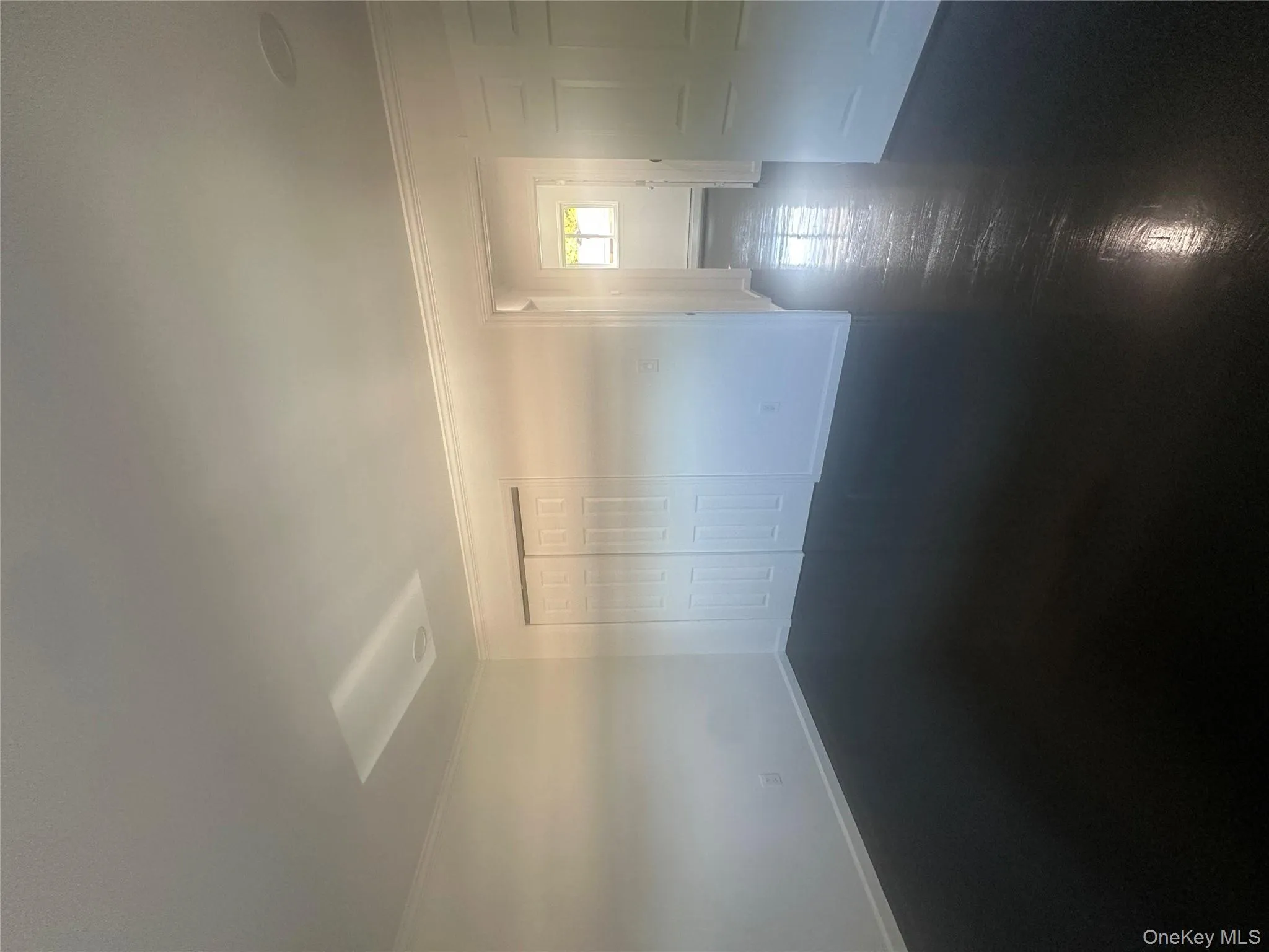 Empty room featuring baseboards and crown molding Empty room featuring baseboards and crown molding