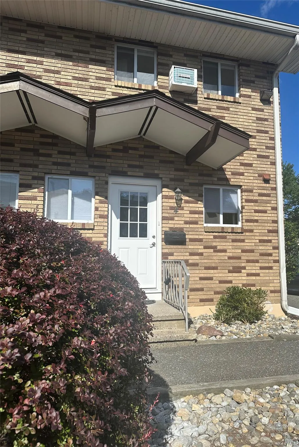 Doorway to property featuring brick siding Doorway to property featuring brick siding