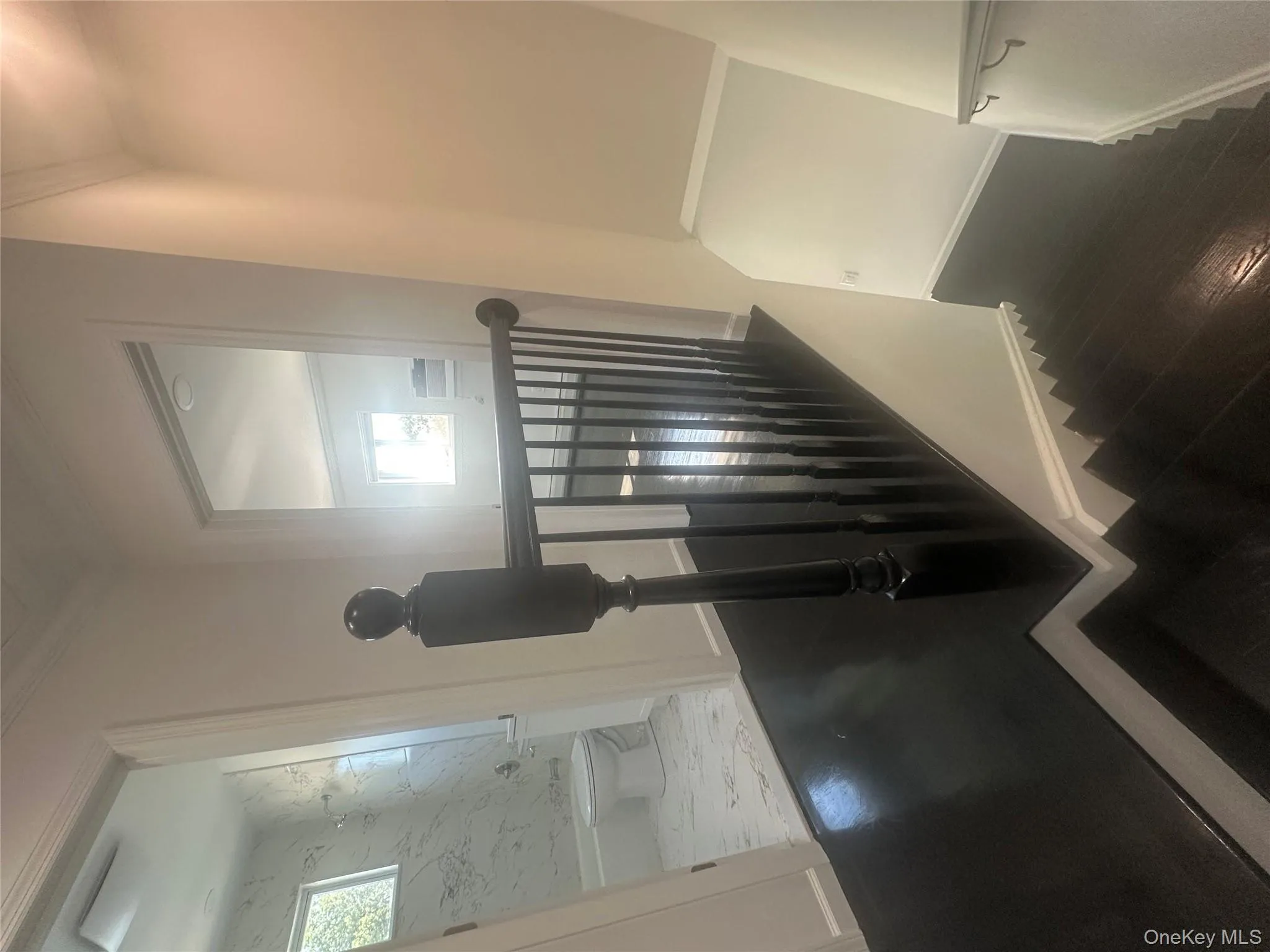 Stairs with ornamental molding and wood finished floors Stairs with ornamental molding and wood finished floors