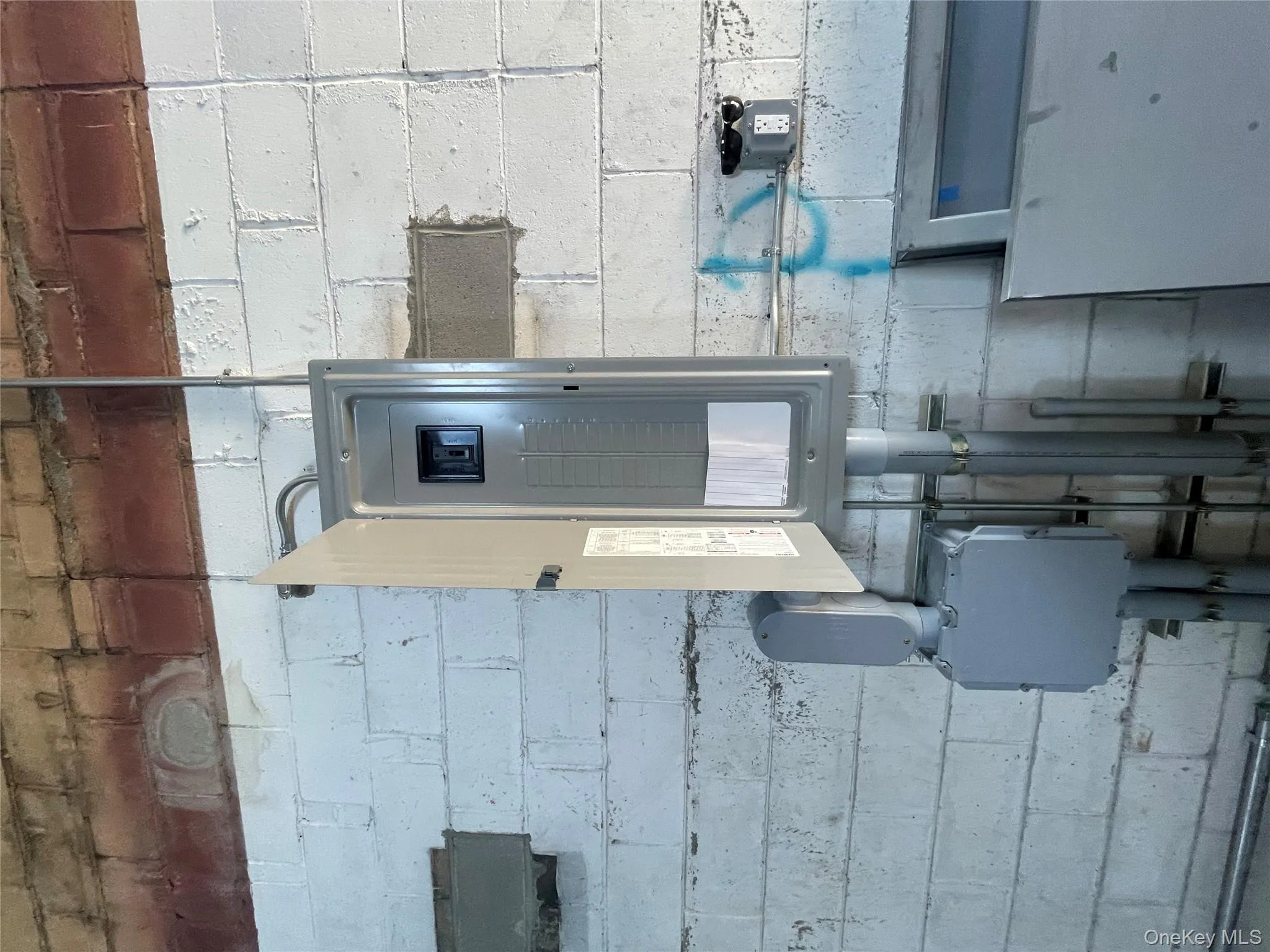 Utility room with electric panel Utility room with electric panel